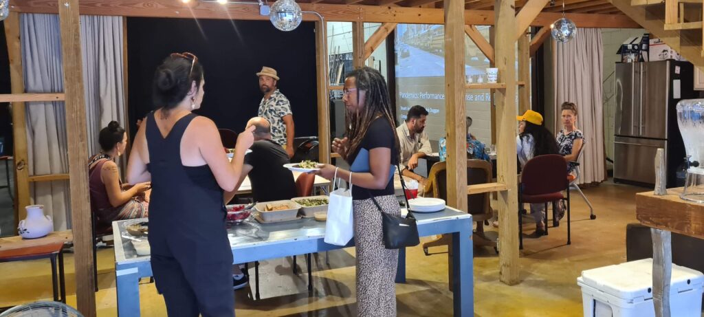 workshop situation, with people in conversation over food